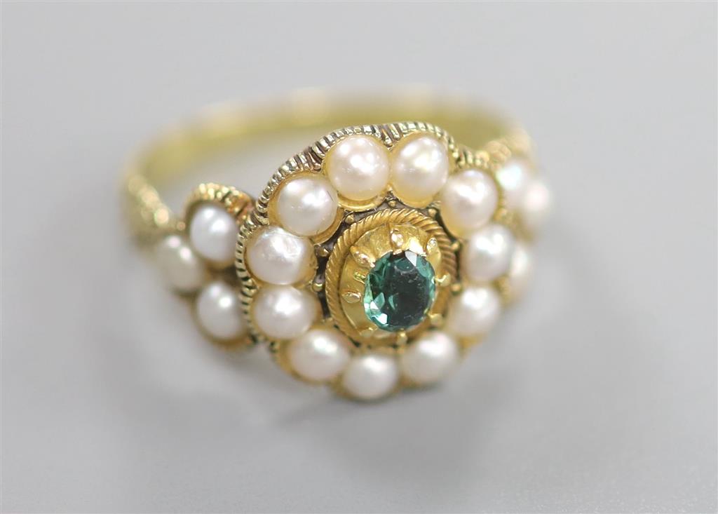 A Victorian yellow metal, split pearl and emerald? set circular cluster ring, size O, gross 4 grams.